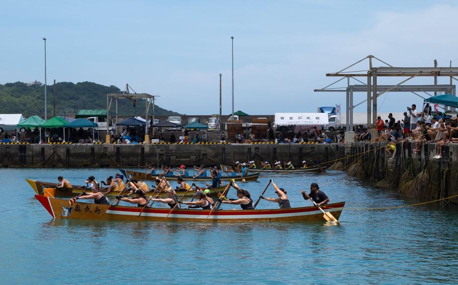 Three boats competing in a boat race.